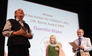 Quenton Blake receiving an award